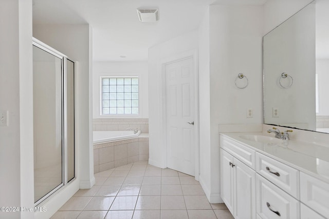 1109 Foxbow Cv, Leland, NC 28451 - bathroom featuring vanity, a shower stall, a bath, and tile patterned flooring