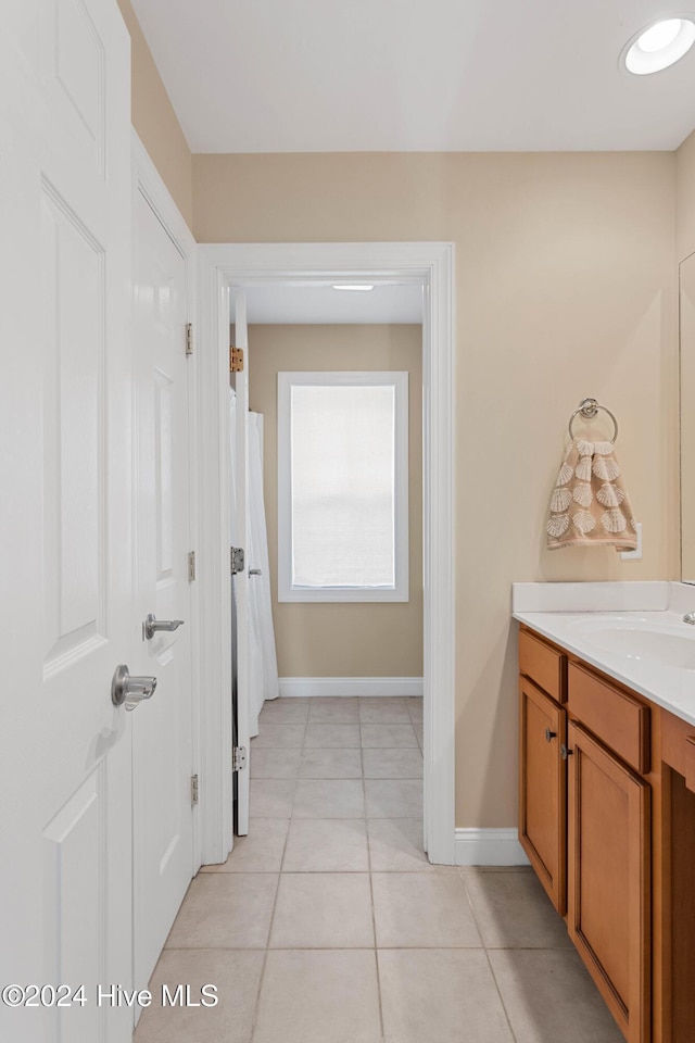 1109 Foxbow Cv, Leland, NC 28451 - full bath featuring vanity, tile patterned floors, and baseboards
