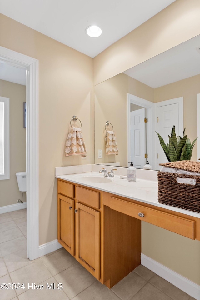 1109 Foxbow Cv, Leland, NC 28451 - bathroom featuring vanity, tile patterned flooring, and baseboards