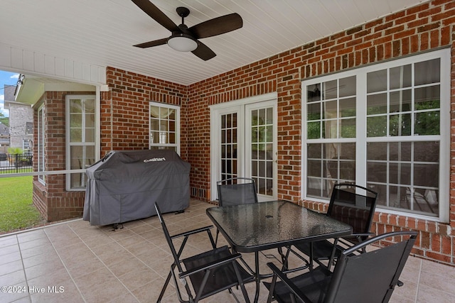 1109 Foxbow Cv, Leland, NC 28451 - view of patio featuring a grill, ceiling fan, and outdoor dining space