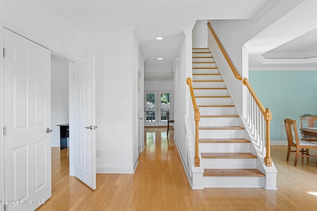 1109 Foxbow Cv, Leland, NC 28451 - staircase featuring hardwood / wood-style floors, baseboards, recessed lighting, french doors, and crown molding