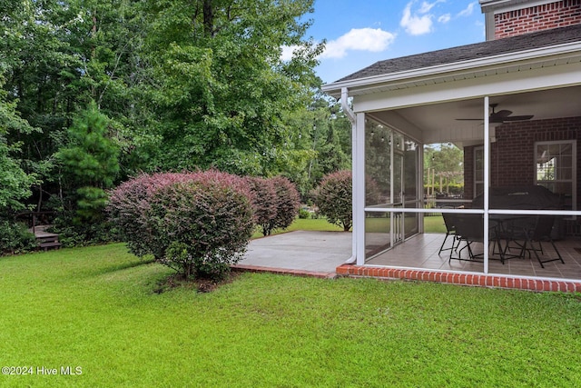 1109 Foxbow Cv, Leland, NC 28451 - view of grassy yard with a patio area, a ceiling fan, and a sunroom