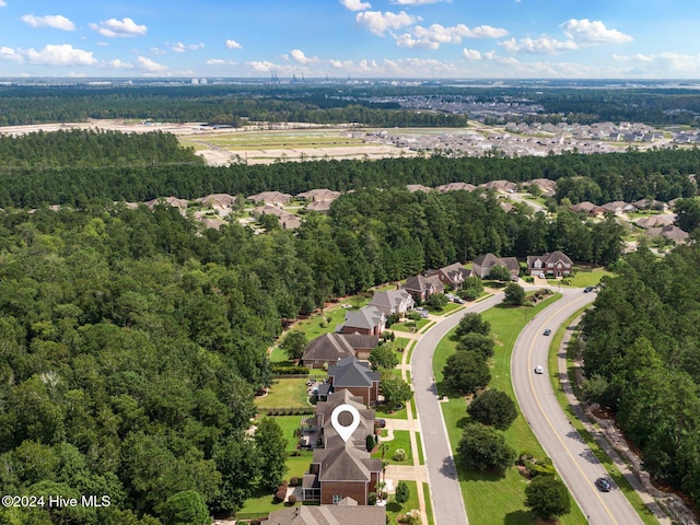 1109 Foxbow Cv, Leland, NC 28451 - aerial perspective of suburban area with a forest