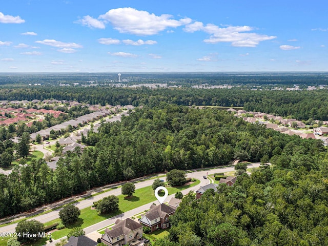 1109 Foxbow Cv, Leland, NC 28451 - aerial perspective of suburban area with a heavily wooded area