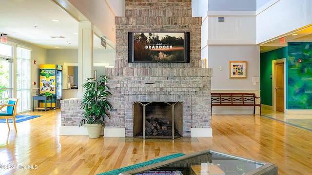 1109 Foxbow Cv, Leland, NC 28451 - living area with wood finished floors and a fireplace