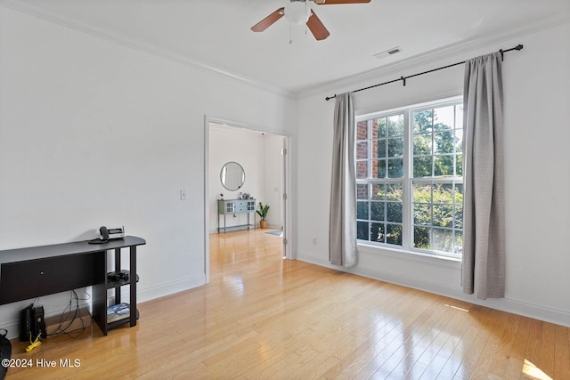 1109 Foxbow Cv, Leland, NC 28451 - spare room with ornamental molding, a ceiling fan, light wood-style floors, and baseboards