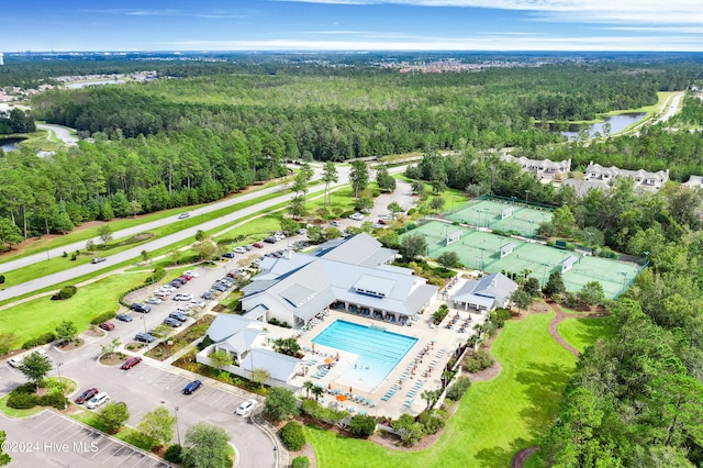 1109 Foxbow Cv, Leland, NC 28451 - aerial view of a heavily wooded area, a large body of water, and a pool area
