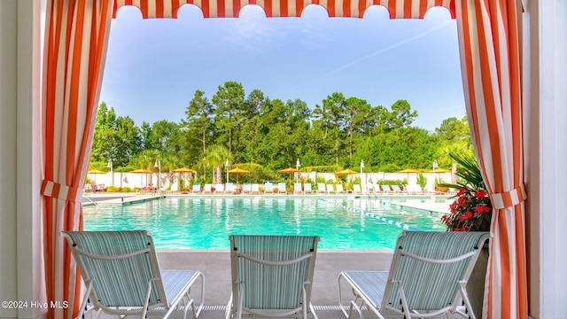 1109 Foxbow Cv, Leland, NC 28451 - community pool with view of wooded area