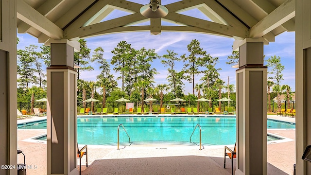 1109 Foxbow Cv, Leland, NC 28451 - community pool featuring ceiling fan and a patio