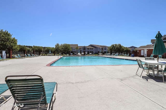 view of swimming pool featuring a patio