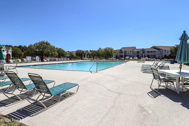 view of swimming pool featuring a patio area