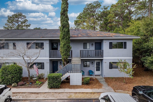 multi unit property featuring a balcony