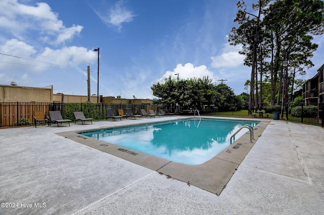 view of pool featuring a patio