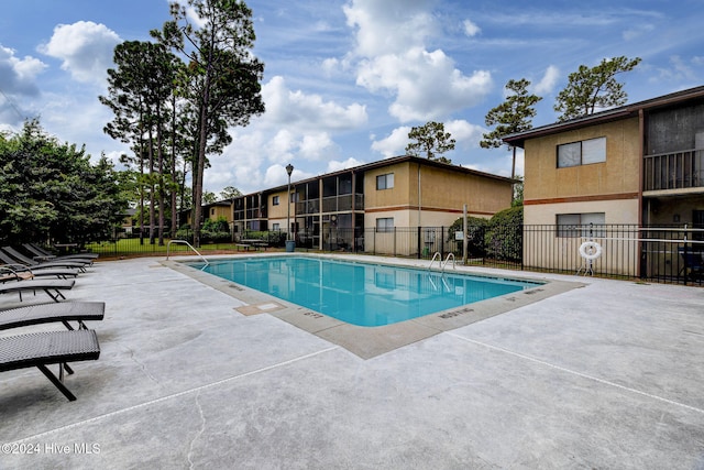 view of swimming pool featuring a patio