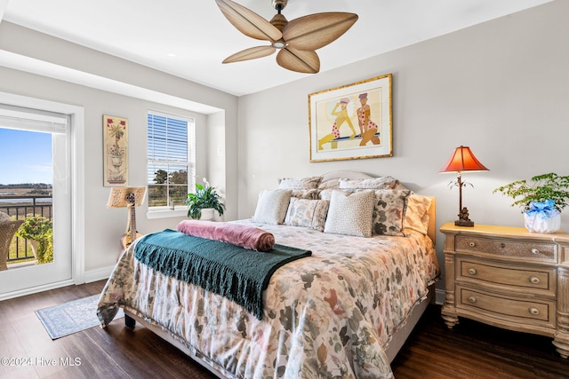 bedroom featuring access to exterior, ceiling fan, and dark wood-type flooring