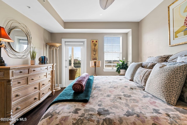 bedroom with dark hardwood / wood-style flooring and access to outside