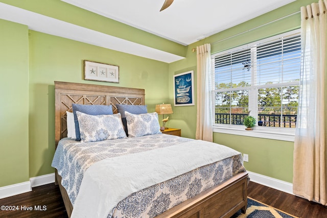 bedroom featuring ceiling fan and dark hardwood / wood-style flooring