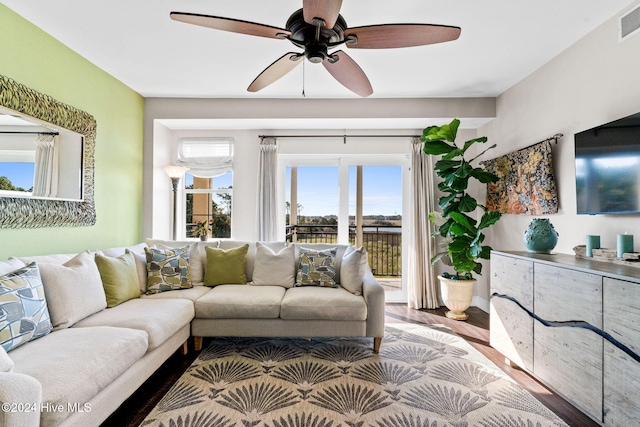 living room with ceiling fan and hardwood / wood-style flooring