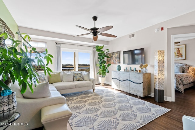 living room with wood-type flooring and ceiling fan