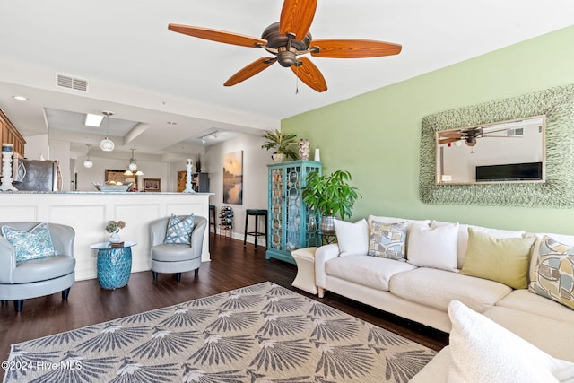 living room with hardwood / wood-style flooring and ceiling fan