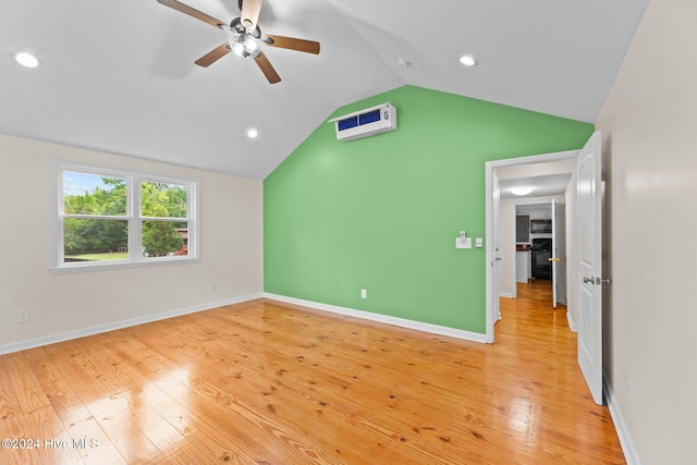 interior space featuring light hardwood / wood-style flooring, ceiling fan, and vaulted ceiling