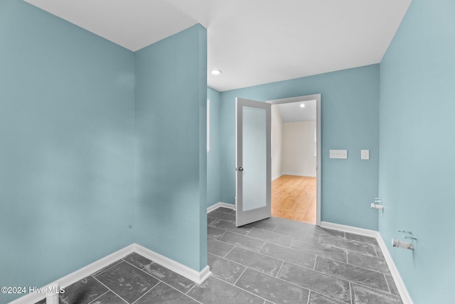 unfurnished room featuring dark hardwood / wood-style floors