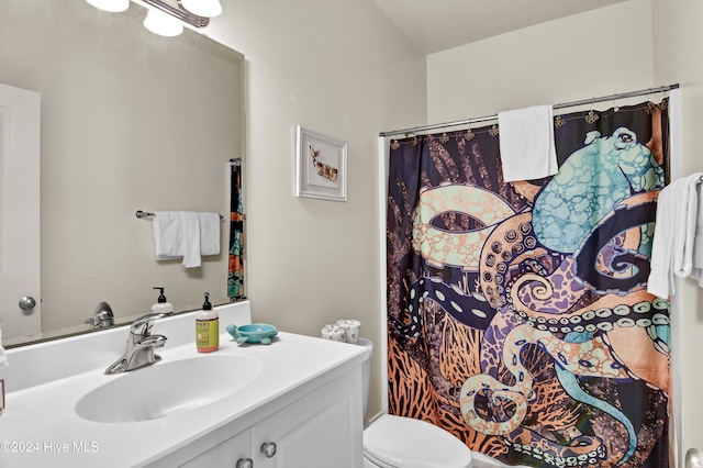 bathroom with a shower with curtain, vanity, and toilet