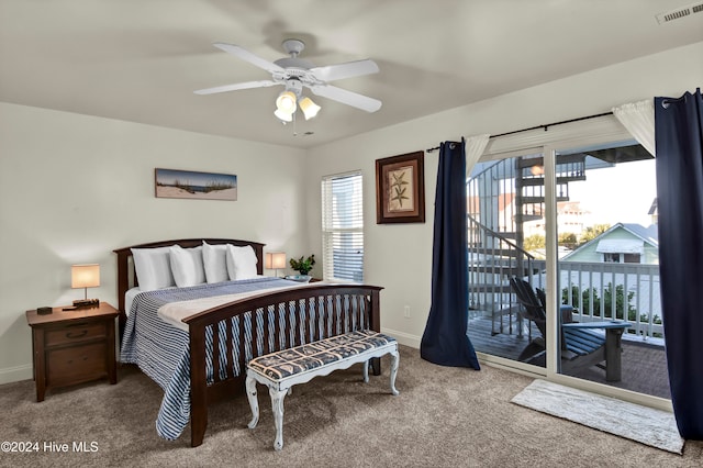 carpeted bedroom featuring access to exterior and ceiling fan