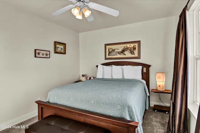 bedroom with ceiling fan and carpet floors