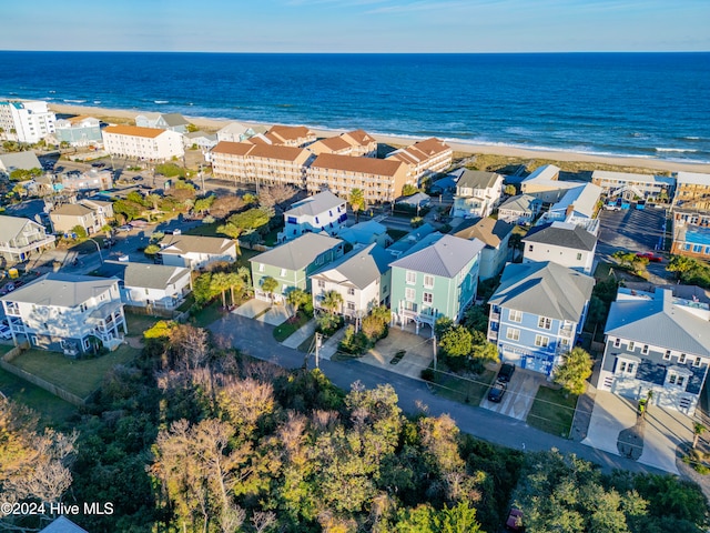 drone / aerial view with a water view and a view of the beach