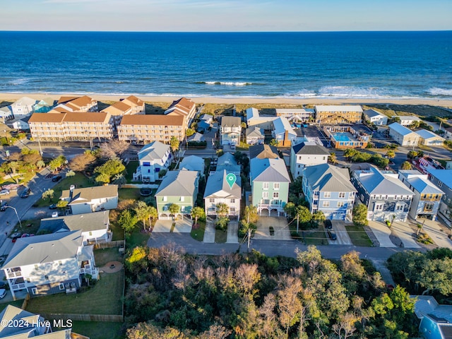 aerial view with a water view and a beach view