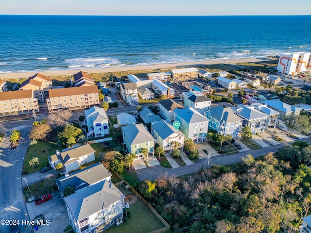 birds eye view of property featuring a water view and a view of the beach