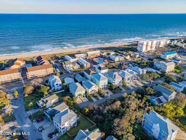 aerial view with a water view and a beach view