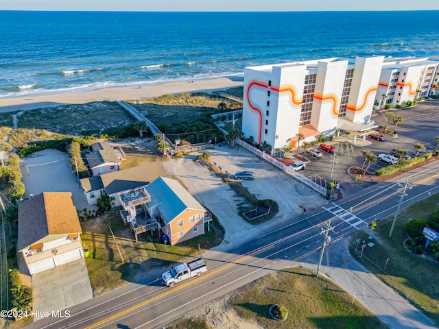 bird's eye view featuring a water view and a beach view