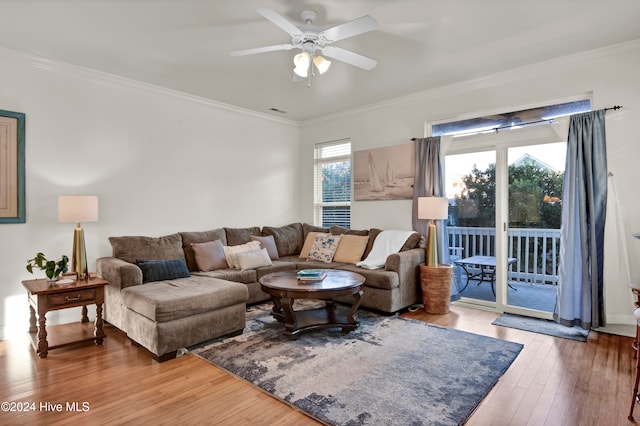 living room with ceiling fan, crown molding, and hardwood / wood-style flooring