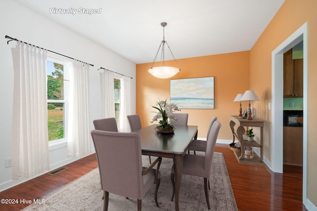 dining area featuring dark hardwood / wood-style flooring