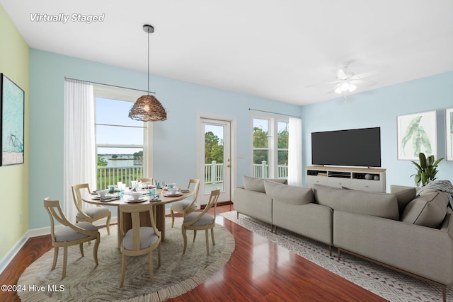 dining room with ceiling fan and hardwood / wood-style flooring