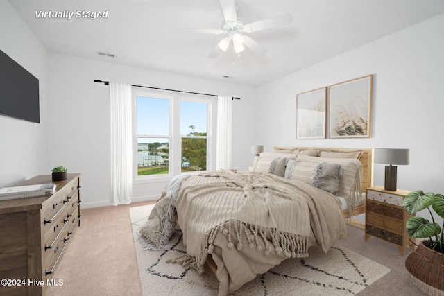 carpeted bedroom featuring ceiling fan