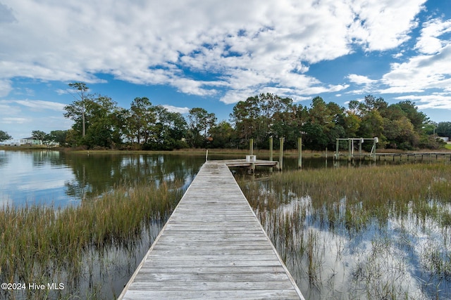 view of dock with a water view