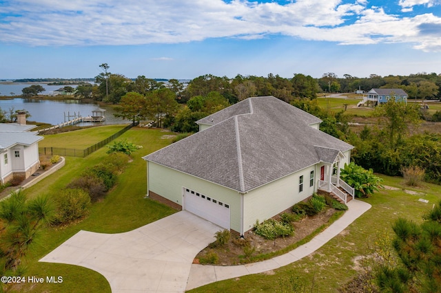 birds eye view of property with a water view