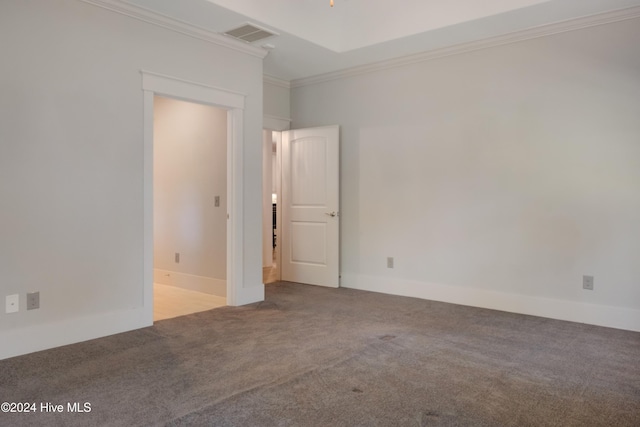 carpeted spare room with crown molding