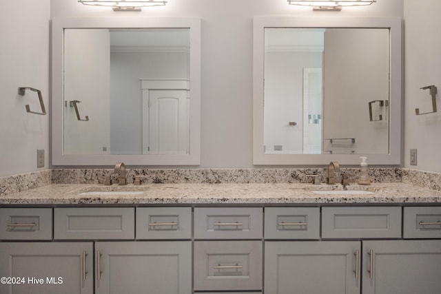 bathroom featuring vanity and crown molding