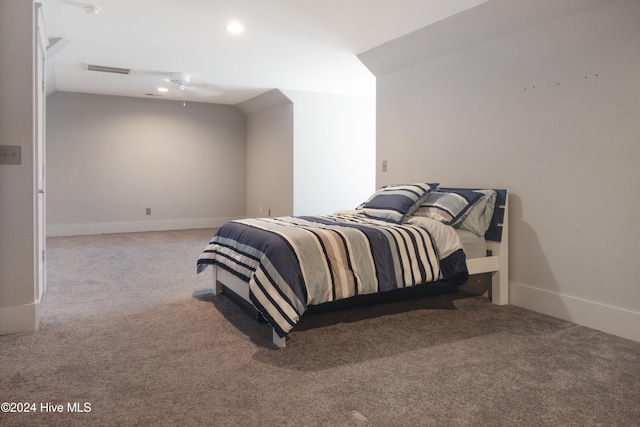 carpeted bedroom featuring vaulted ceiling