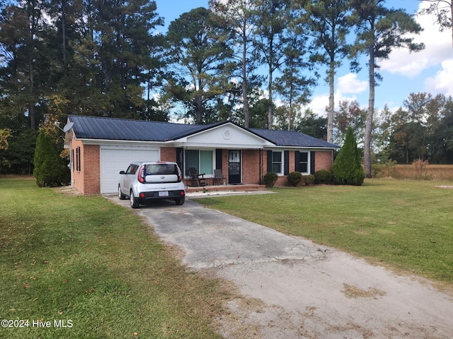 single story home with a front yard and a garage