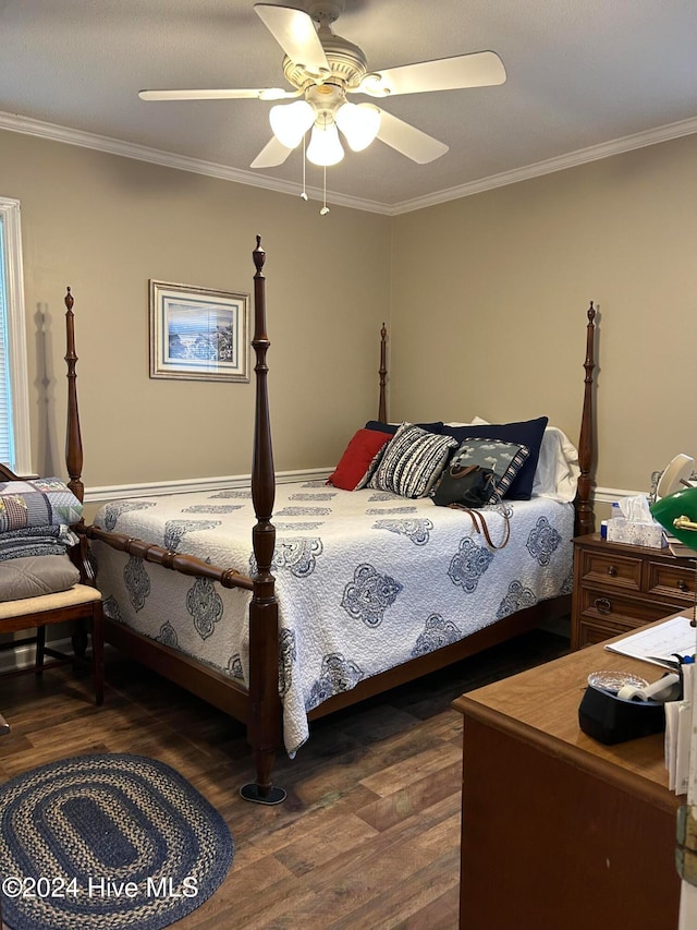 bedroom with dark hardwood / wood-style flooring, crown molding, and ceiling fan