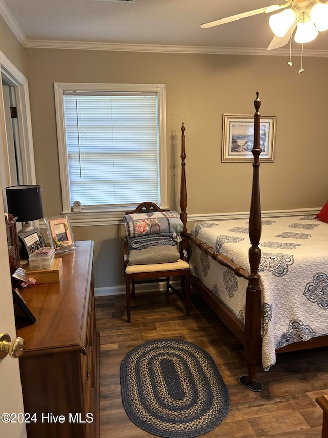 bedroom with crown molding, dark wood-type flooring, and ceiling fan