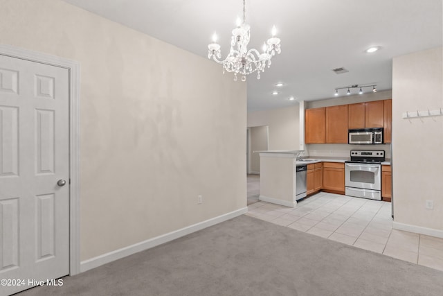 kitchen with pendant lighting, light carpet, an inviting chandelier, kitchen peninsula, and stainless steel appliances