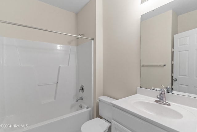 full bathroom with toilet, vanity, and bathing tub / shower combination