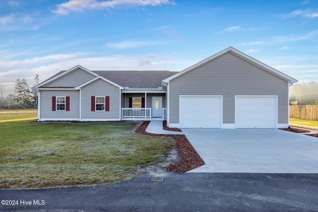 34 Bless Ave, Bolton, NC 28423 - single story home featuring covered porch, a garage, concrete driveway, and a front yard