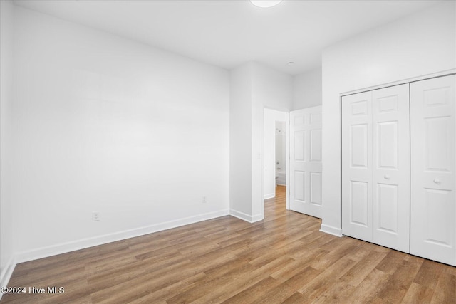 34 Bless Ave, Bolton, NC 28423 - unfurnished bedroom with wood finished floors, baseboards, and a closet